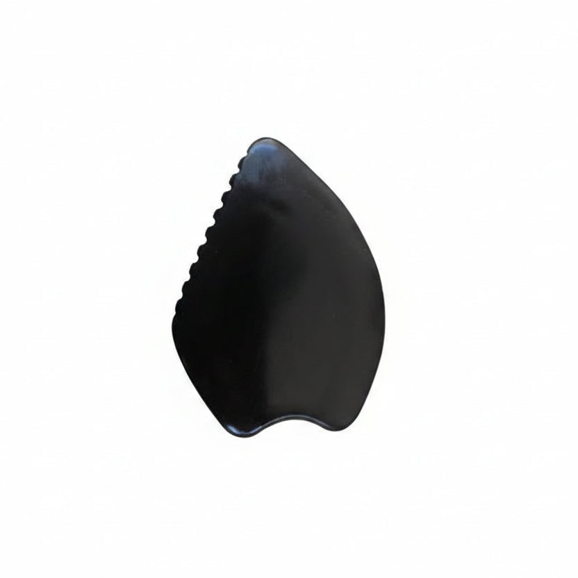 Black Bian stone gua sha on a white background
