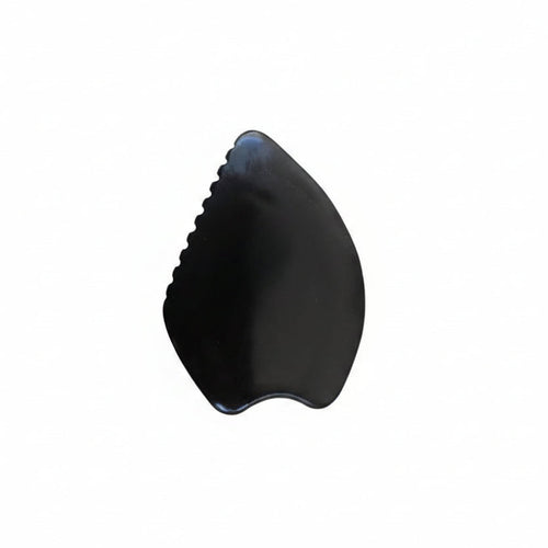 Black Bian stone gua sha on a white background