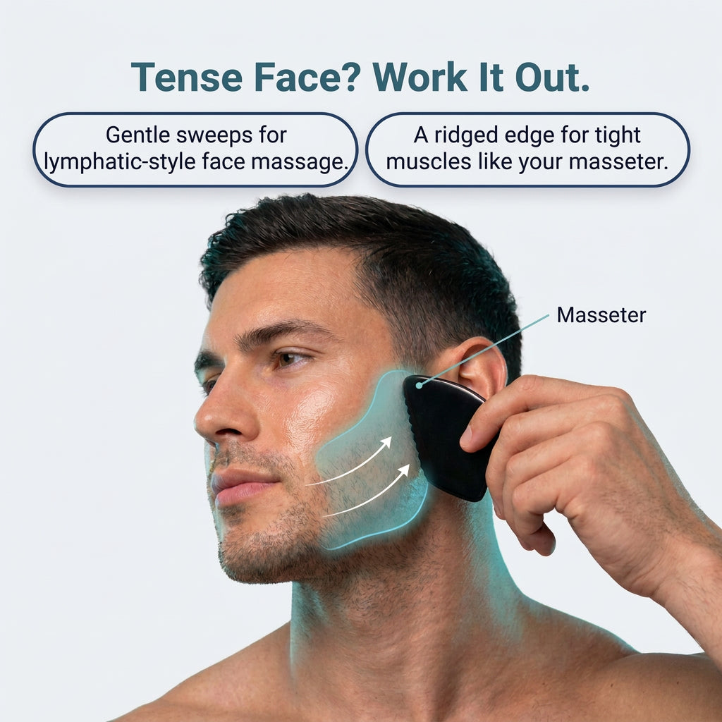 Man using the gua sha along his jaw to release a tight masseter