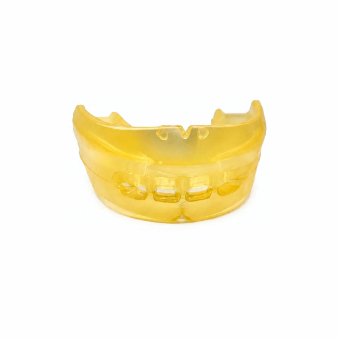 Skelgear Reviv flat-plane mouthguard in yellow on a white background